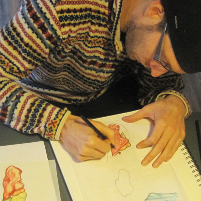 Drawing the Heel Bone – Reflexology Visual Dictionary in Progress Top-down view of artist drawing the heel bone for reflexology chart, part of the Visual Dictionary Series